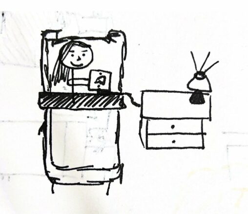 The stick figure is using her phone in bed at night. The phone is connected to the charger and there is a lamp switched on, on top of the night table