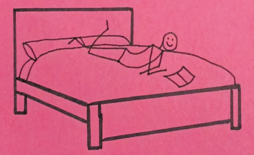 Stick person laying on a bed reading. One foot in the air and the other on a pillow. Stick person is smiling.