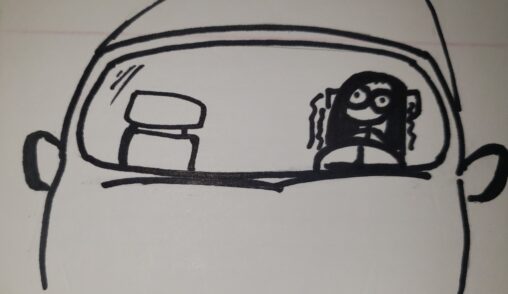 A girl seen through a vehicle windshield, sitting in the drivers seat, wide eyes and shaking.