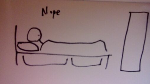 A stick figure lies in a detailed bed with the word \'Nope\' above him. There is no movement.